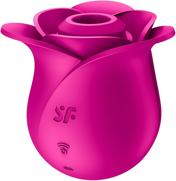 a pink vase with a flower inside of it