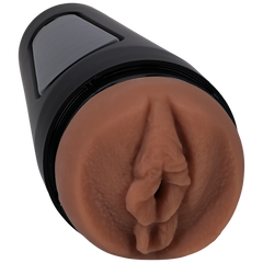a close up of a brown object on a black background