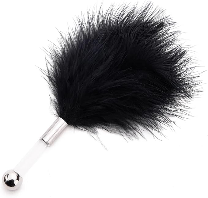 Close-up shot of a plush black feather tickler with a silver handle, designed for a touch of elegance and playful sensations in intimate settings.