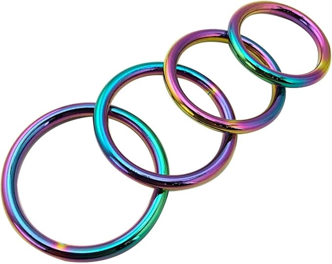 A luxurious set of colourful, chrome metal cock rings in various sizes arranged in a stylish formation, showcasing vibrant rainbow hues that enhance pleasure and sophistication.