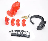 Complete set of premium red chastity components, including interchangeable parts, elegant lock, and additional accessories, all presented in a sophisticated layout.