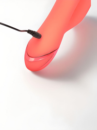 Close-up of the charging port on the Orange County Cutie Thrusting Silicone Rabbit Vibrator, emphasising modern convenience and sleek design.