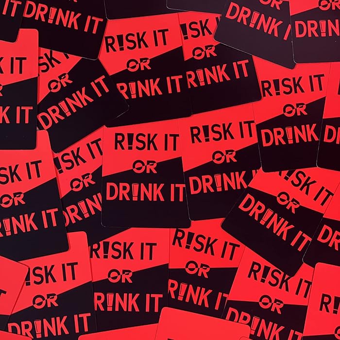 a pile of red and black stickers that say risk it or drink it