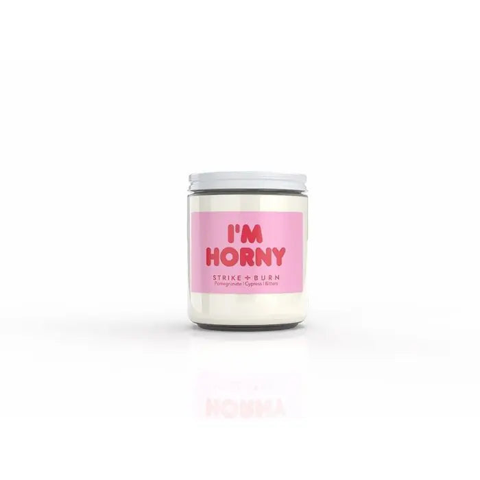 Elegant Strike & Burn I'm Horny Candle featuring a luxurious blend of pomegranate, cypress, and bitters for an inviting, romantic ambiance. Perfect for indulging your senses.