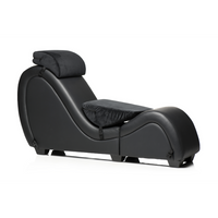 a black reclining chair with a pillow on top of it