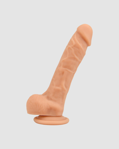 Loving Joy Realistic Silicone Dildo with Suction Cup and Balls surrounded by romantic decor.