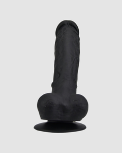 Captivating display of the Loving Joy Realistic Silicone Dildo with Suction Cup and Balls in an intimate ambiance.