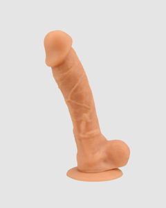 Thoughtfully styled presentation of the Loving Joy Realistic Silicone Dildo with Suction Cup and Balls.