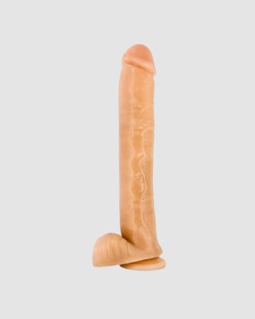 Large 14-inch realistic dildo with balls from Blush Novelties, featuring detailed texture and lifelike appearance.
