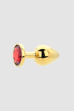 An alluring Toosh Butt Plug With Gems in luxurious packaging, designed for the discerning pleasure seeker.