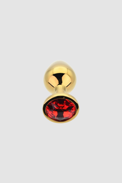 Toosh Butt Plug With Gems artistically arranged to display its sleek form and superior materials.