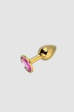 A display of the Toosh Butt Plug With Gems, focusing on its smooth surface and aesthetic enhancements.