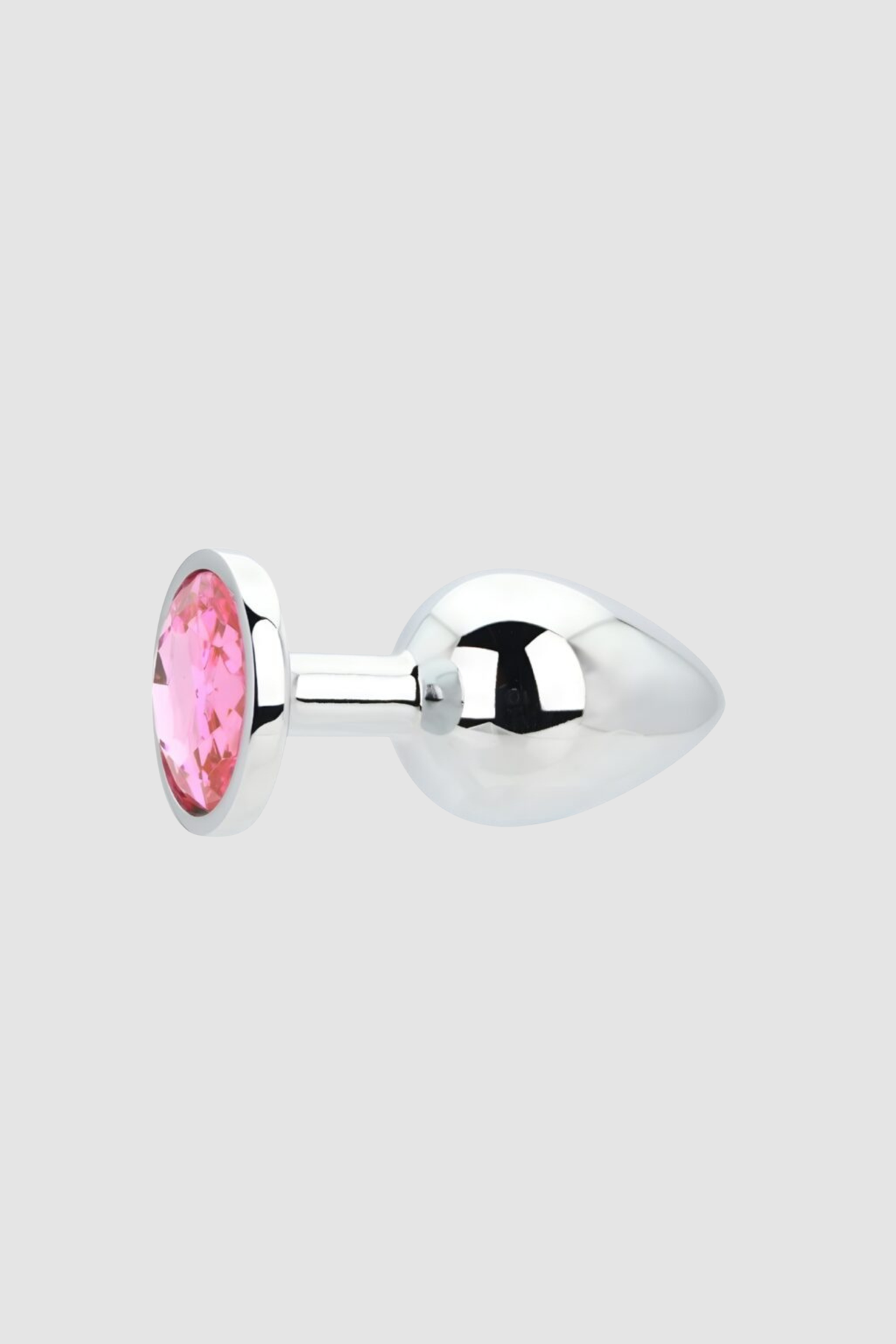 Toosh Butt Plug With Gems nestled amongst luxury items, accentuating its role as both a pleasure device and decorative piece.