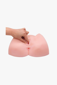 Silicone mold shaped like a butt on a white background