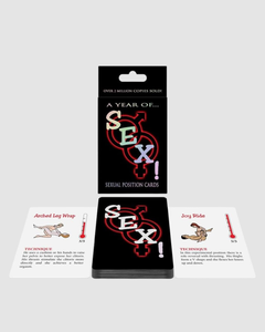 Couples playing "A Year Of Sex" sexual positions card game with dice set, featuring colorful cards and game components.