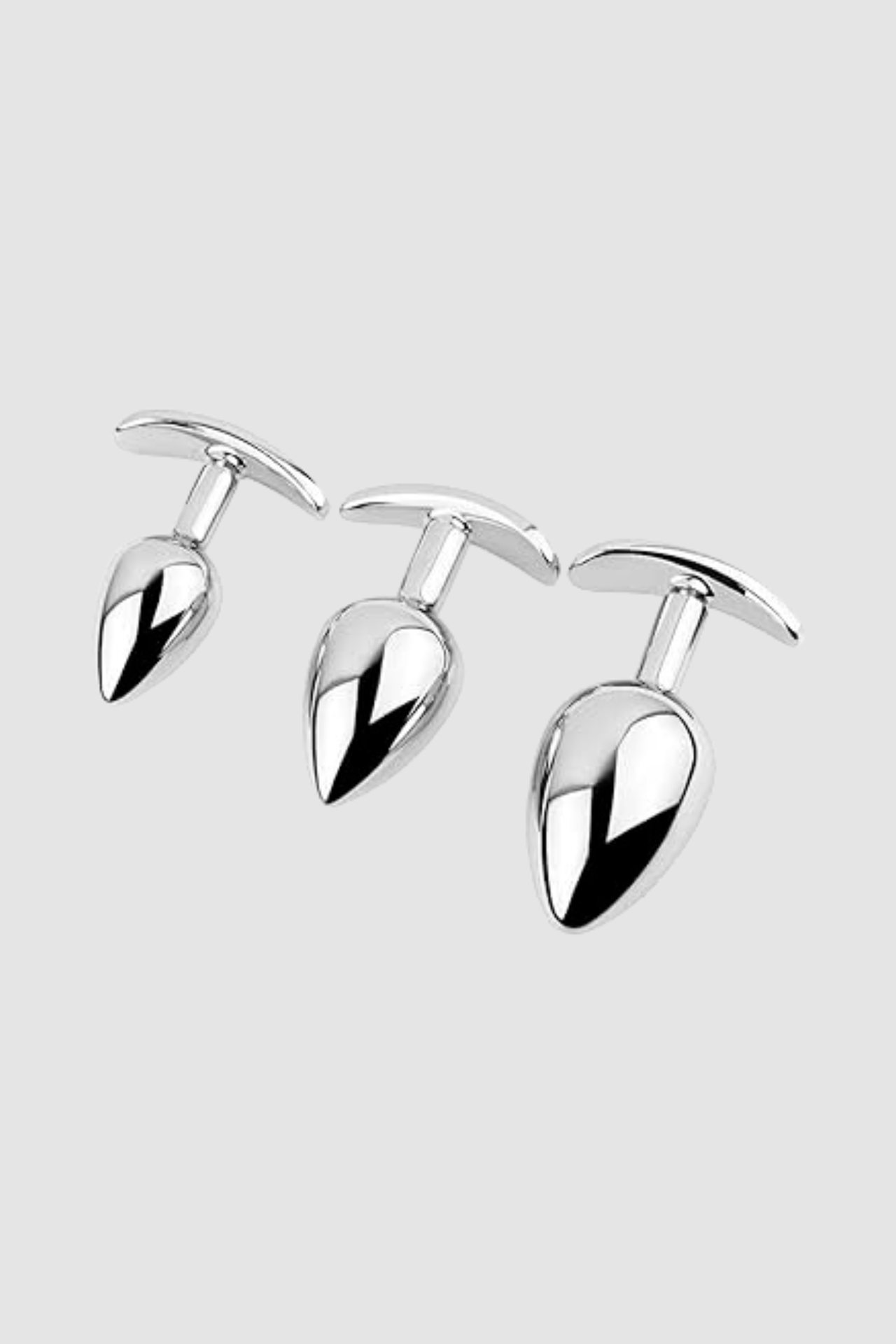 Close-up of the high-quality stainless steel weighted butt plug with metal anchor base by Scandals, highlighting its polished finish for easy cleaning.