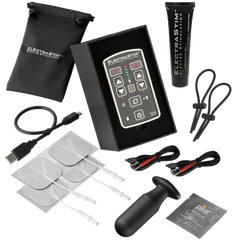 a black box with a pair of scissors and other items