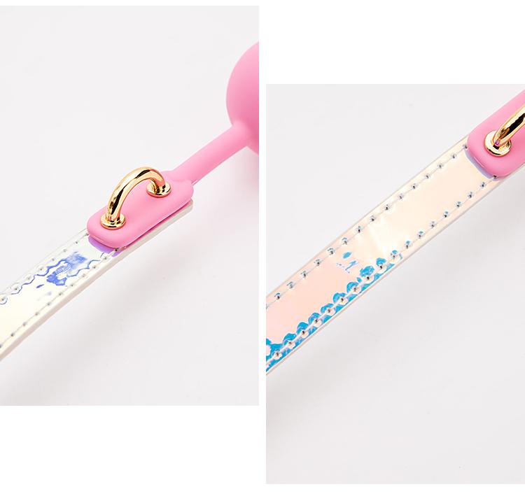 a pink and white measuring tape with a pink handle