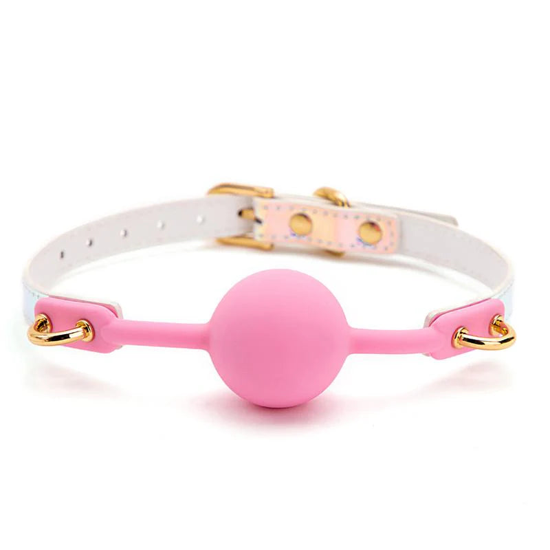 a pink ball and a white collar on a white background