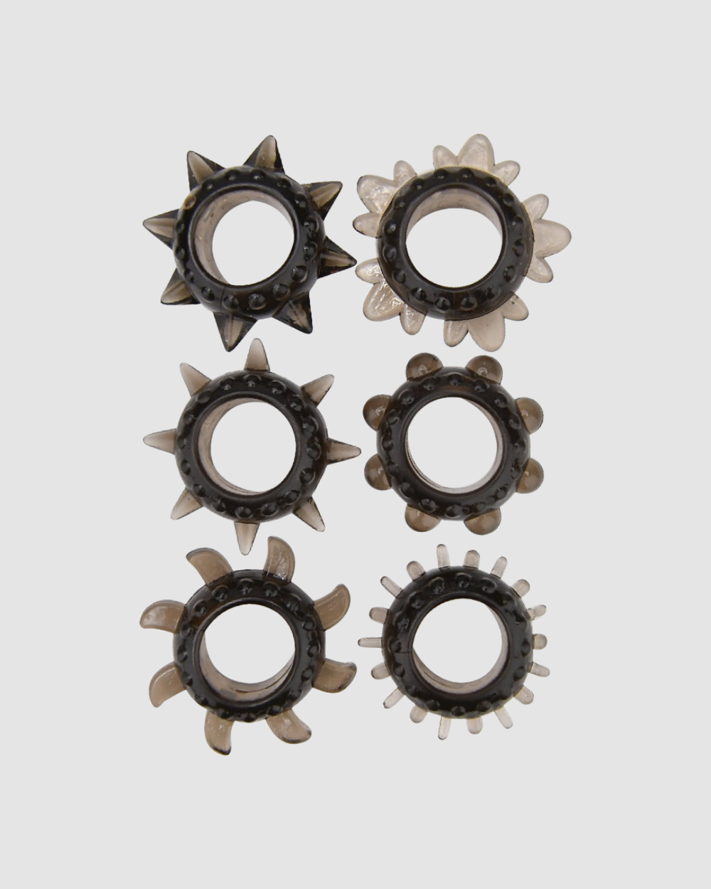 Loving Joy Luxe textured cock ring set with six rings in various designs for enhanced pleasure, shown in a close-up image.