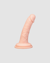 Versatile use of the Me You Us Ultracock Strap On Harness Kit, featuring the dildo’s suction-cup base for hands-free play, enhancing erotic experiences.