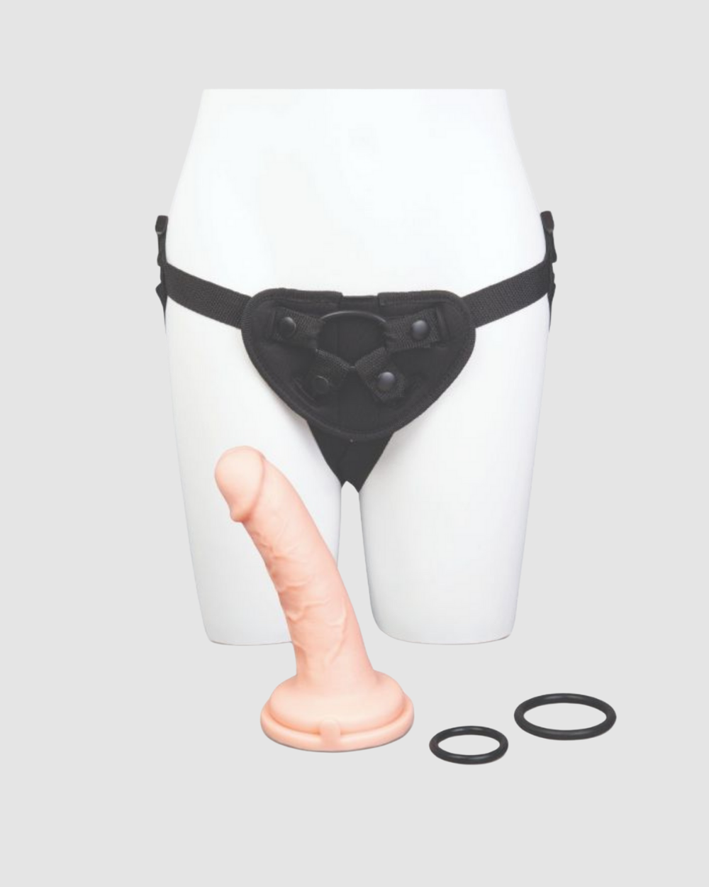Me You Us Ultracock strap-on harness kit with a 6-inch realistic dildo, shown in a close-up of the harness and dildo details.