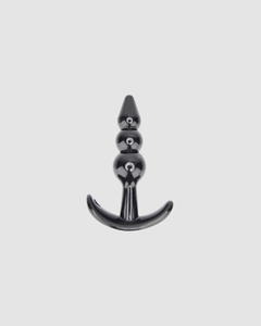 Artistic view of the Loving Joy Butt Plug Training Kit, underscoring the vibrant purple colour and ideal design for a pleasurable experience.