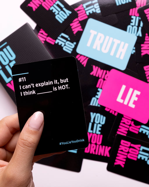 a person holding up a card with the words truth on it