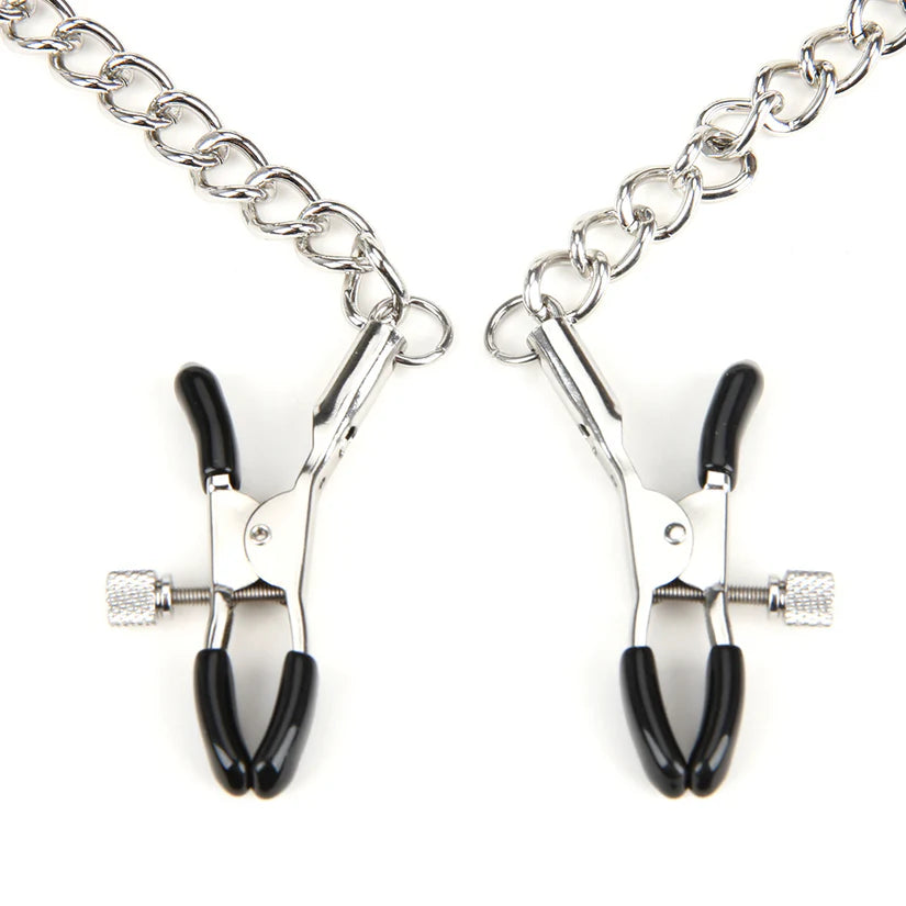 a pair of scissors on a chain on a white background