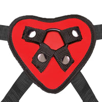 a red heart with two black straps attached to it