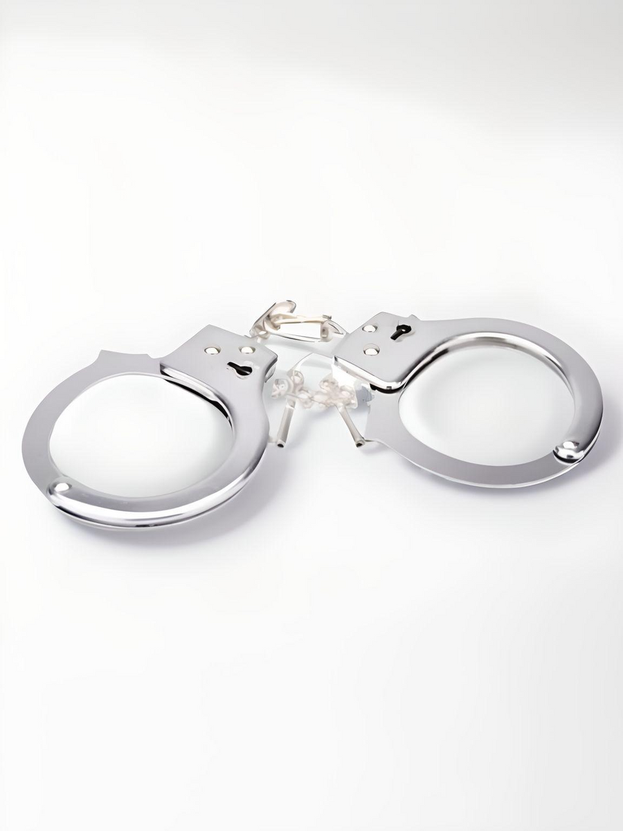 Luxury Heavy Duty Handcuffs featuring a shiny, chrome finish with a quick-release unlocking system, perfect for intimate moments.