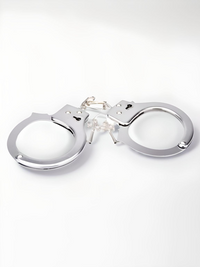 Luxury Heavy Duty Handcuffs featuring a shiny, chrome finish with a quick-release unlocking system, perfect for intimate moments.