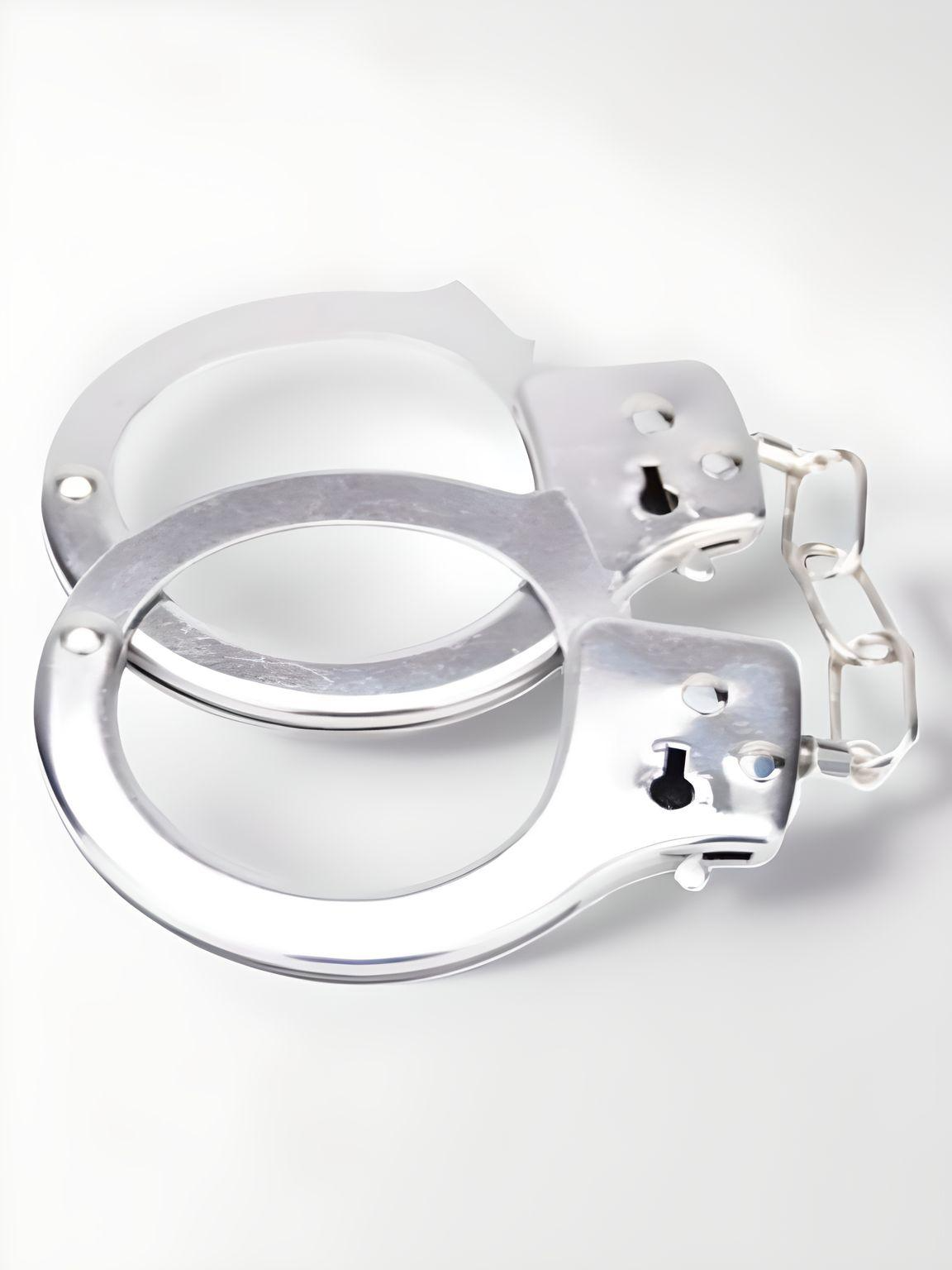 Elegant Heavy Duty Handcuffs designed with precision in gleaming metal, ideal for enhancing bondage experiences.
