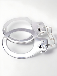 Elegant Heavy Duty Handcuffs designed with precision in gleaming metal, ideal for enhancing bondage experiences.