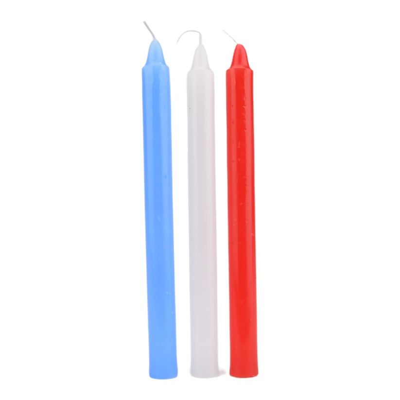 a pair of red and blue candles sitting next to each other