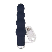 Nauti silicone ribbed vibrator displayed with USB charging cable, emphasizing its convenience and eco-friendly rechargeable feature.