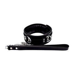 Bound to Please leather collar with padded comfort, padlockable buckle, and three D-rings for secure fittings.