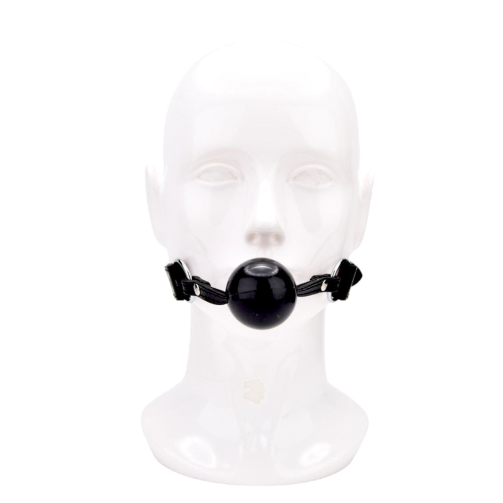 Bound leather solid ball gag with adjustable buckle, featuring two O-rings for secure fit, in a close-up view.