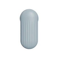 a light blue plastic object on a white background