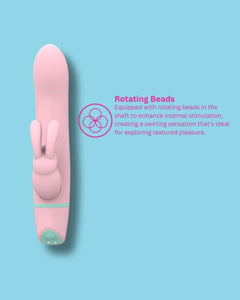 MINA Ripple 5-function rotating rabbit vibrator with clitoral stimulation, waterproof design, pink silicone finish, shown on a white background.