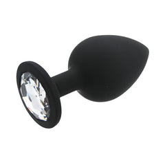 Black anal plug with a crystal detail on a white background