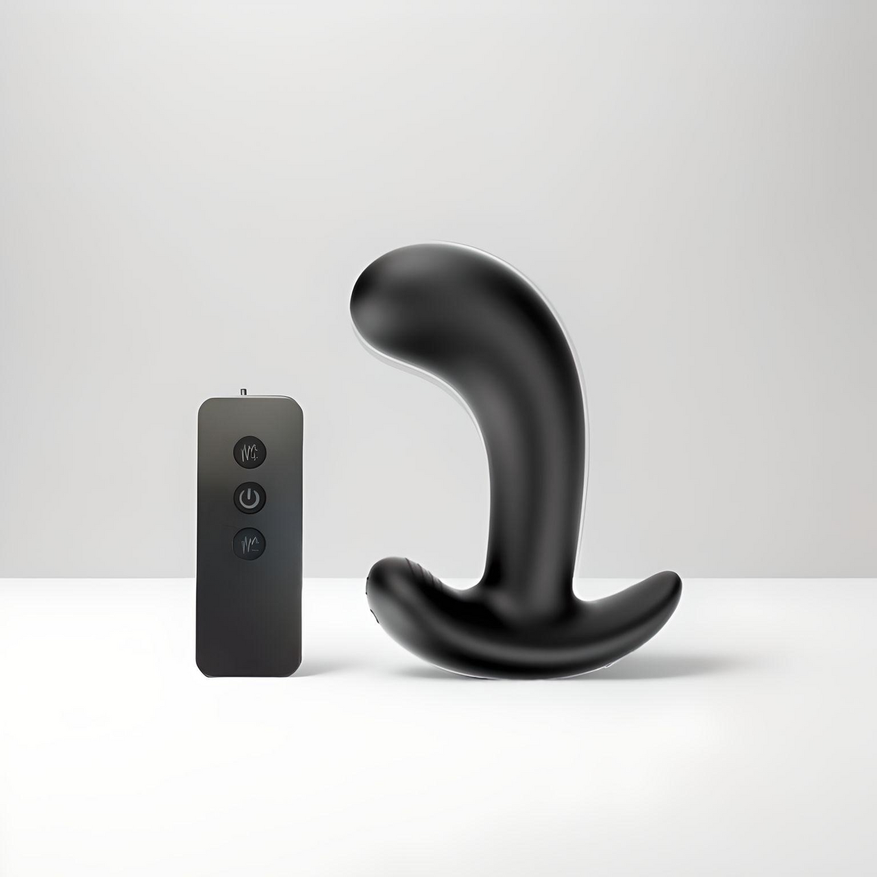a remote control sitting next to a black object