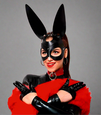 a woman wearing a bunny mask and gloves