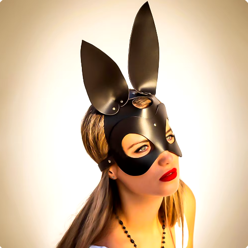 a woman wearing a bunny mask and a necklace