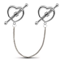 Luxurious heart-shaped nipple clamps with a polished finish, connected by a delicate metal chain, designed for sensual stimulation and pleasure. Ideal for sensory play and BDSM activities.