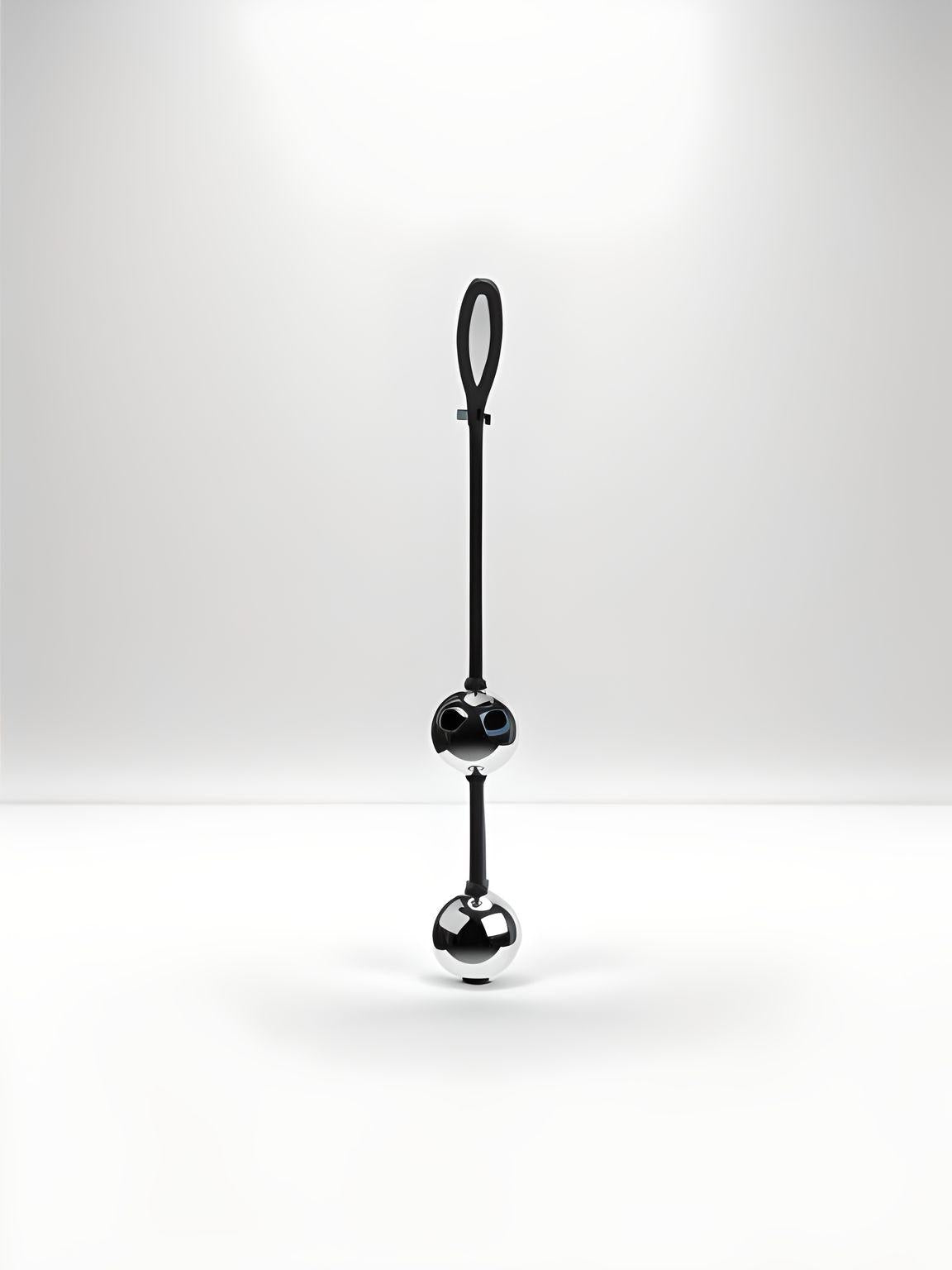 a black pole with a black ball on top of it