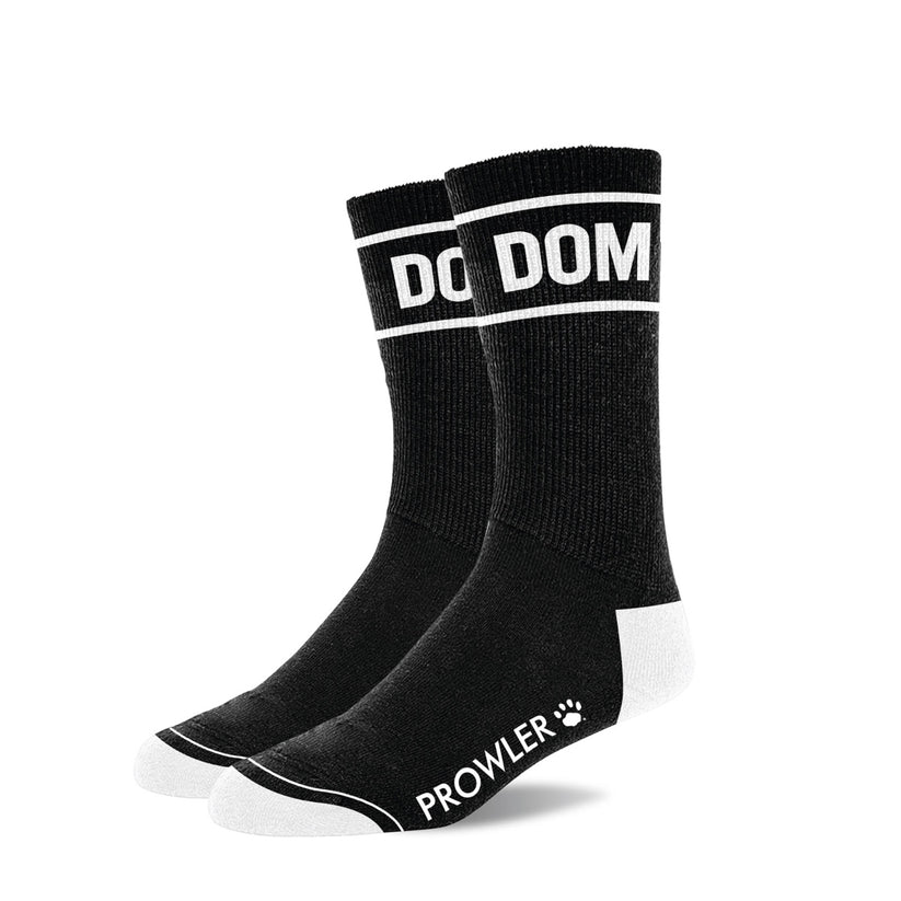 a pair of black socks with the word dom on them