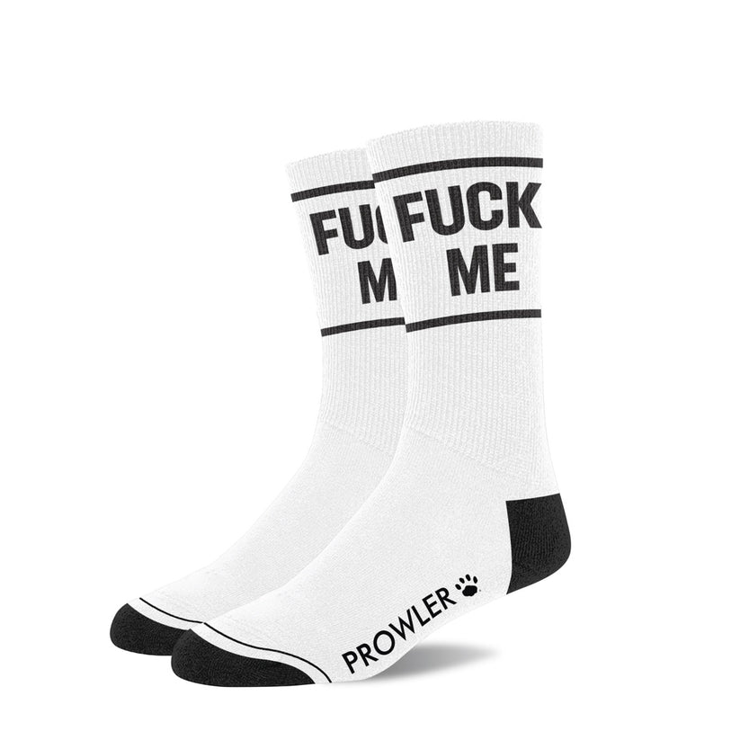 a pair of white socks that say fuck me