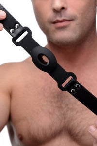 a man holding a strap on his right hand