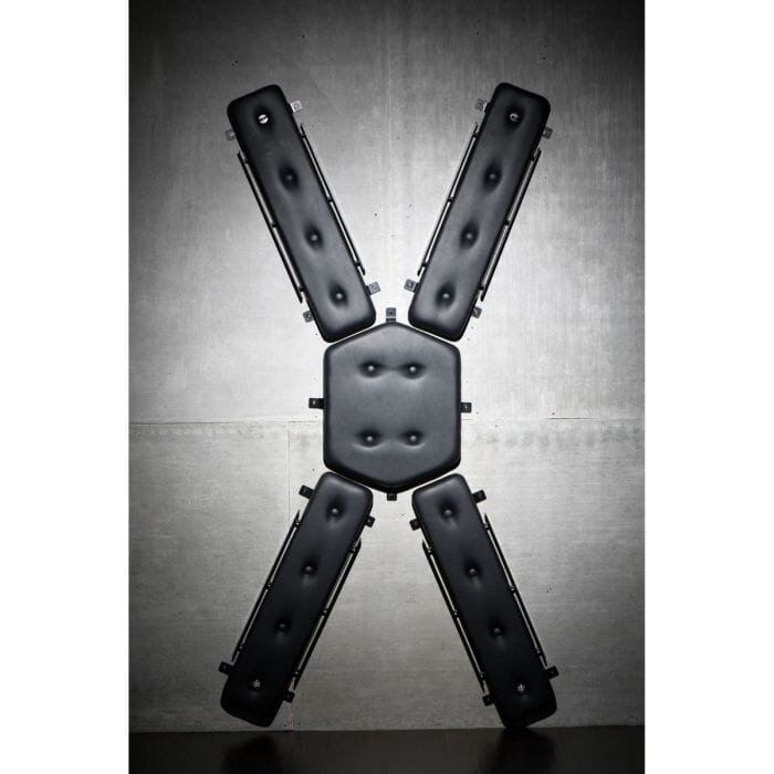 Black wall-mounted St. Andrew's Cross from Master Series with sturdy frame and padded surface for secure attachment.